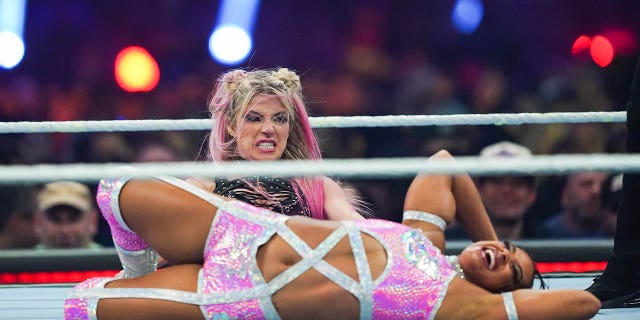 Bianca Belair, bottom, and Alexa Bliss wrestle during the Raw Women's championship during the WWE Royal Rumble at the Alamodome on Jan. 28, 2023 in San Antonio.