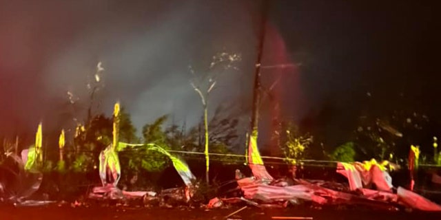 Debris wrapped around trees in Amory, Miss., after a tornado struck the town on Friday, March 24, 2023.