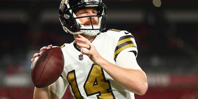 Andy Dalton of the New Orleans Saints warms up prior to a game against the Tampa Bay Buccaneers at Raymond James Stadium Dec. 5, 2022, in Tampa, Fla.