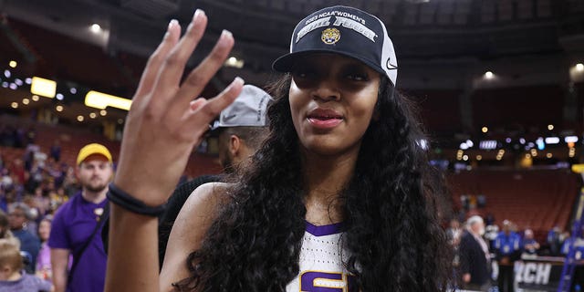 Angel Reese, #10 of the LSU Lady Tigers, celebrates after defeating the Miami Hurricanes 54-42 in the Elite Eight round of the NCAA Women's Basketball Tournament at Bon Secours Wellness Arena on March 26, 2023 in Greenville, SC South.