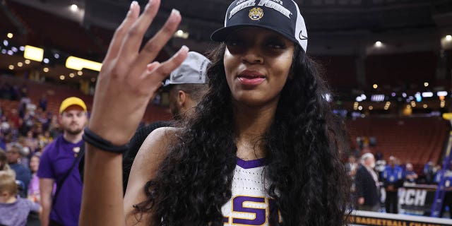 Angel Reese, #10 of the LSU Lady Tigers, celebrates after defeating the Miami Hurricanes 54-42 in the Elite Eight round of the NCAA Women's Basketball Tournament at Bon Secours Wellness Arena on March 26, 2023 in Greenville, SC South.