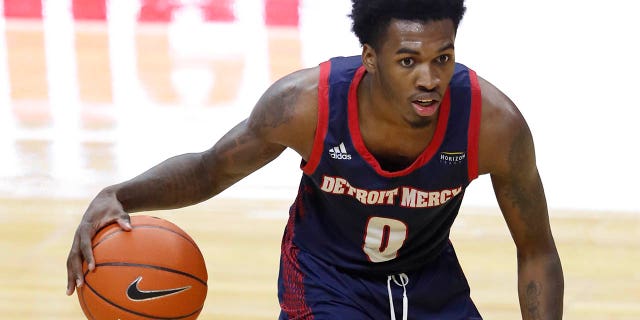 Detroit Titans guard Antoine Davis, #0, dribbles the ball during the second half against the Michigan State Spartans at the Jack Breslin Student Events Center in East Lansing, Michigan on December 4, 2020.