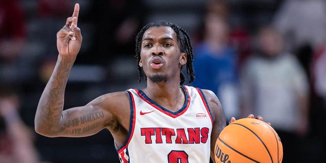 Antoine Davis, #0 of the Detroit Mercy Titans, brings the ball up court during the game against the Cincinnati Bearcats at Fifth Third Arena on Dec. 21, 2022 in Cincinnati.
