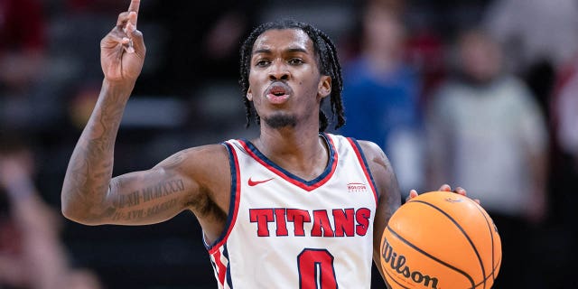 Antoine Davis, #0 of the Detroit Mercy Titans, brings the ball up court during the game against the Cincinnati Bearcats at Fifth Third Arena on Dec. 21, 2022 in Cincinnati.