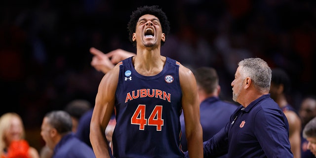 Dylan Cardwell #44 of the Auburn Tigers reacts after a basket during the second half against the Iowa Hawkeyes in the first round of the NCAA Men's Basketball Tournament at Legacy Arena at the BJCC on March 16, 2023 in Birmingham, Alabama.