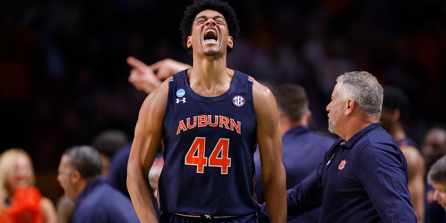 Dylan Cardwell #44 of the Auburn Tigers reacts after a basket during the second half against the Iowa Hawkeyes in the first round of the NCAA Men's Basketball Tournament at Legacy Arena at the BJCC on March 16, 2023 in Birmingham, Alabama.