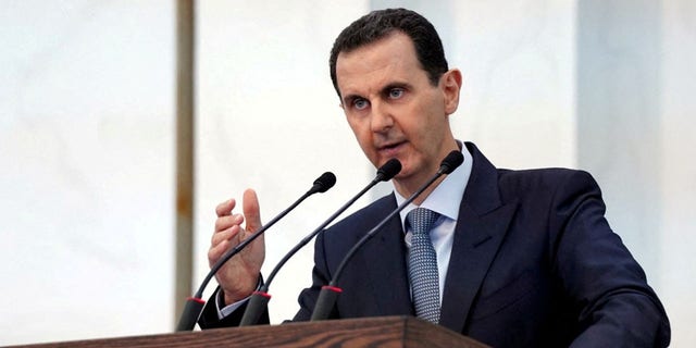 FILE: Syria's President Bashar al-Assad addresses the new members of parliament in Damascus, Syria in this handout released by SANA on August 12, 2020. 