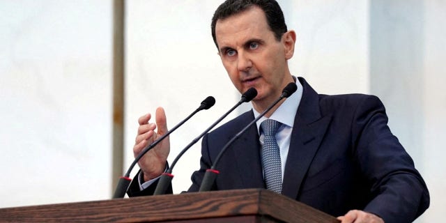 FILE: Syria's President Bashar al-Assad addresses the new members of parliament in Damascus, Syria in this handout released by SANA on August 12, 2020. 