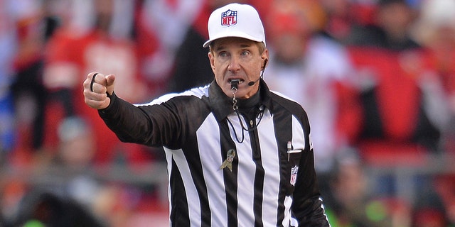 Referee Bill Leavy starts play during a game between the Kansas City Chiefs and the Seattle Seahawks on November 16, 2014 at Arrowhead Stadium in Kansas City, Missouri. 