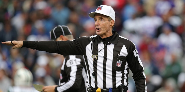 Referee Bill Leavy makes a call during the Buffalo Bills' game against the New York Jets at Ralph Wilson Stadium Nov. 17, 2013, in Orchard Park, N.Y.