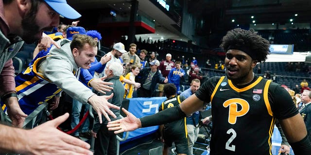 Pittsburgh's Blake Hinson celebrates with fans after Pittsburgh defeated Mississippi State in a First Four game in the NCAA men's college basketball tournament Tuesday, March 14, 2023, in Dayton, Ohio.