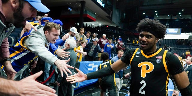 Pittsburgh's Blake Hinson celebrates with fans after Pittsburgh defeated Mississippi State in a First Four game in the NCAA men's college basketball tournament Tuesday, March 14, 2023, in Dayton, Ohio.
