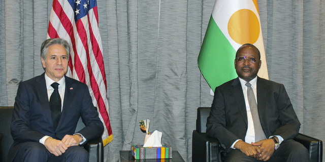 U.S. Secretary of State Antony Blinken, left, is seated with Nigerien Foreign Minister Hassoumi Massoudou at the Diori Hamani International Airport, in Niamey, Niger, on Thursday, March 16. The meeting happened days before Woodke's release was announced.