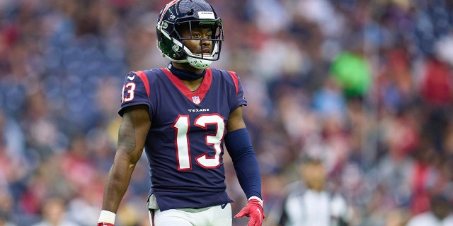 Brandin Cooks of the Houston Texans walks toward the huddle against the Jacksonville Jaguars during the second half at NRG Stadium Jan. 1, 2023, in Houston.