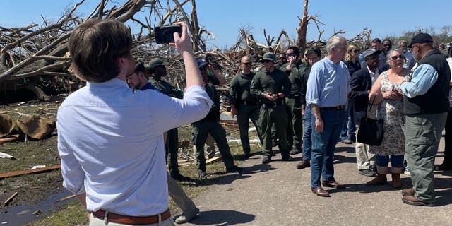 Democrat Mississippi gubernatorial candidate Brandon Presley's campaign staff take photos of him at the tornado survey that featured elected officials though he was not invited to attend, according to a source.