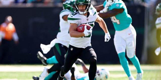 New York Jets number 10 Braxton Berrios runs against the Miami Dolphins during the first quarter at MetLife Stadium on October 9, 2022 in East Rutherford, New Jersey.