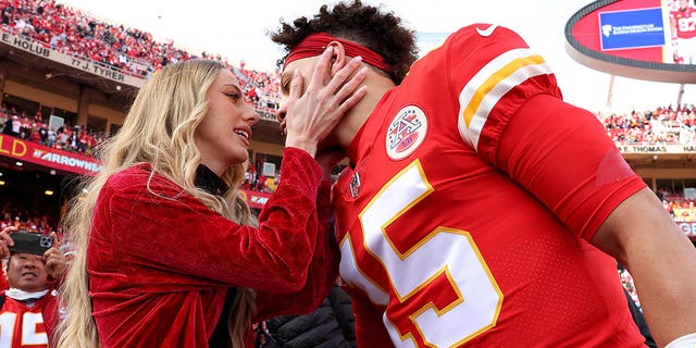 Quarterback Patrick Mahomes of the Chiefs kisses his then-finance Brittany Matthews before the start of the AFC Championship game against the Cincinnati Bengals at Arrowhead Stadium on Jan. 30, 2022, in Kansas City, Missouri.