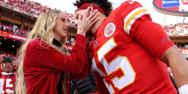 Quarterback Patrick Mahomes of the Chiefs kisses his then-finance Brittany Matthews before the start of the AFC Championship game against the Cincinnati Bengals at Arrowhead Stadium on Jan. 30, 2022, in Kansas City, Missouri.
