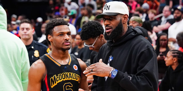 LeBron James talks to his son, Bronny, on the court