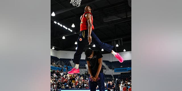 McDonald's All-American West guard Bronnie James, #6, dunks the ball during the Powerade Jam Fest at the Delmar Athletic Complex in Houston on March 27, 2023.