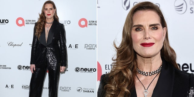 Brooke Shields walked the red carpet at the Elton John Aids Foundation Oscars watch party wearing a black pantsuit with a plundging neckline.