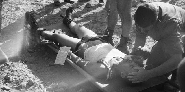 A wounded French soldier is attended to by a doctor after he was injured in a huge car bomb attack at a building housing members of the French contingent of the peacekeeping forces in Beirut, on Oct. 23, 1983.