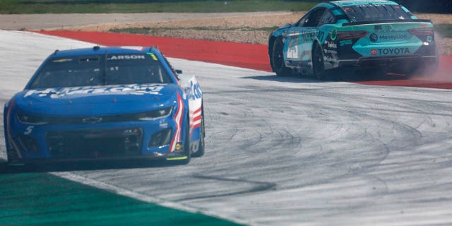 Bubba Wallace, driver of the #23 MoneyLion Toyota, and Kyle Larson, driver of the #5 HendrickCars.com Chevrolet, spin after an on-track incident during the NASCAR Cup Series EchoPark Automotive Grand Prix at Circuit of The Americas on March 26, 2023 in Austin, Texas.