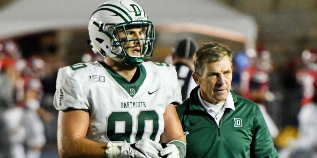 Buddy Teevens talks to the player