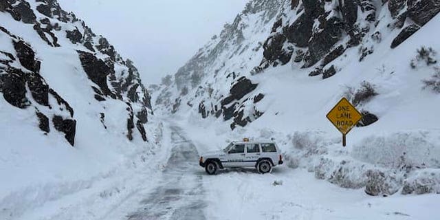 This image released by Inyo County Search and Rescue (InyoSAR) shows InyoSAR members search for a missing person near an area along Death Valley Road, Death Valley National Park, Calif.