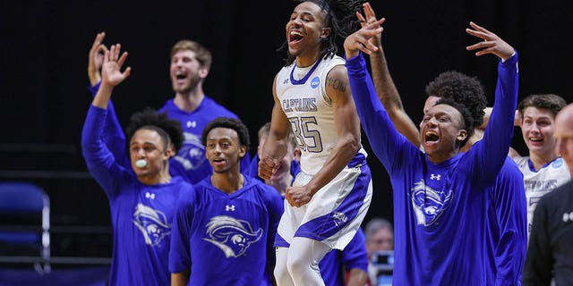 Christopher Newport Captains players cheer during the Division III Men's Basketball Championship at the Allen County War Memorial Coliseum on March 18, 2023, in Fort Wayne, Indiana.