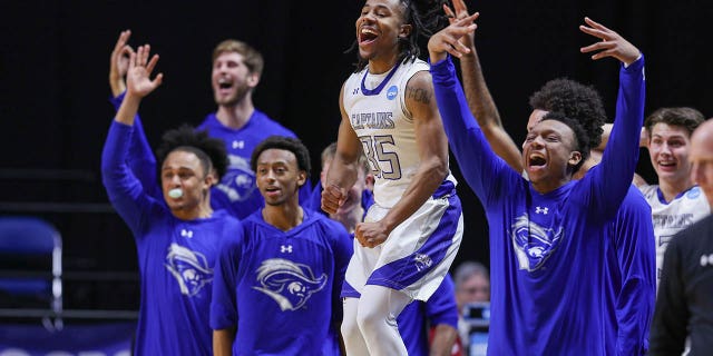 Christopher Newport Captains players cheer during the Division III Men's Basketball Championship at the Allen County War Memorial Coliseum on March 18, 2023, in Fort Wayne, Indiana.