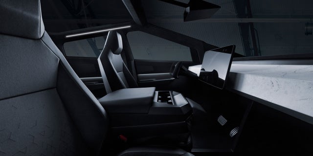 Cybertruck press photos show it with a central seat that can be folded down to create an armrest.