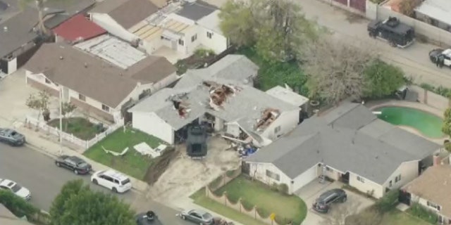 Deputies had made holes in the roof of the home to pinpoint the location of a suspect who had barricaded himself inside and fired upon responding deputies.