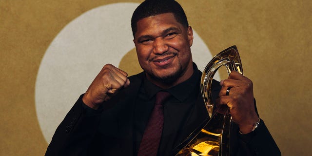 Calais Campbell poses for a photo after winning the Art Rooney Sportsmanship Award during the NFL Honors at Symphony Hall on February 9, 2023 in Phoenix, Arizona.