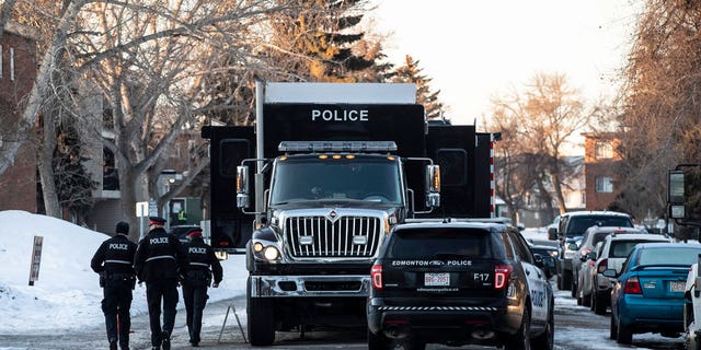 Police investigate the scene where two officers were shot and killed on duty in Edmonton on March 16, 2023.