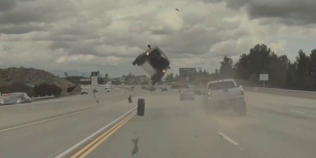 The dark-colored Kia struck the loose tire and went airborne on the Ronald Reagan Freeway near Los Angeles.