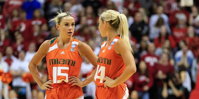 Miami Hurricanes guard Haley Cavinder (14) and Hanna Cavinder (15) play against Indiana University during the second round NCAA women's basketball tournament game at Simon Skjodt Assembly Hall. The Hoosiers lost to the Hurricanes 70-68.