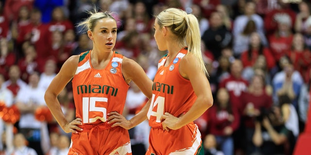 Miami Hurricanes guards Haley Cavinder (14) and Hanna Cavinder (15) play Indiana University during the second round of the NCAA Tournament at Simon Skjodt Assembly Hall.