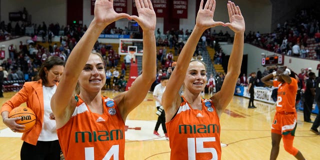 Haley Cavinder, #14, and Hanna Cavinder, #15, of Miami, celebrate after Miami defeated Indiana in a second round college basketball game in the NCAA Women's Tournament on Monday, March 20, 2023, in Bloomington , Indiana.