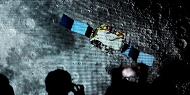 Screenshots are shown of a spacecraft for the Chang'e-5 mission, during an event for the Chinese Lunar Exploration Program, at the National Astronomical Observatories of the Chinese Academy of Sciences (CAS), in Beijing, China, Jan. 18, 2021. 