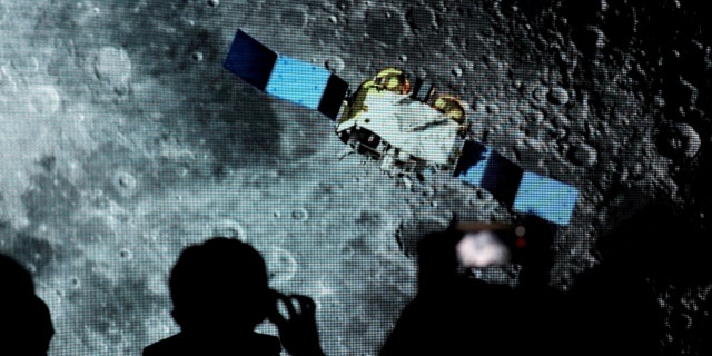 Screenshots are shown of a spacecraft for the Chang'e-5 mission, during an event for the Chinese Lunar Exploration Program, at the National Astronomical Observatories of the Chinese Academy of Sciences (CAS), in Beijing, China, Jan. 18, 2021.