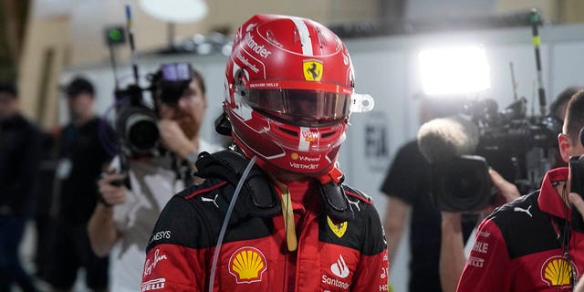 Ferrari driver Charles Leclerc walks back to the pit lane after his car stalled during the Formula One Bahrain Grand Prix, Sunday, March 5, 2023.