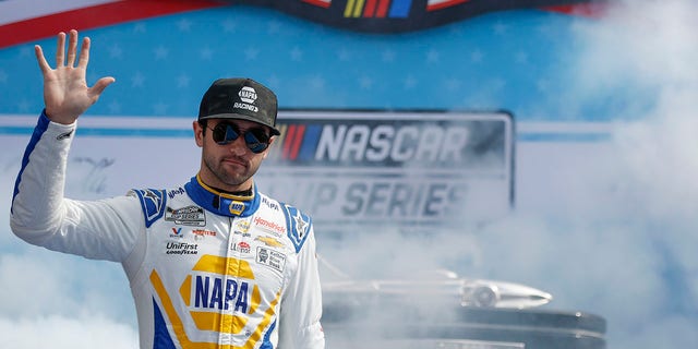 Chase Elliott, driver of the No. 9 NAPA Auto Parts Chevrolet, greets fans as he walks onstage during driver introductions ahead of the 65th Annual NASCAR Cup Series Daytona 500 at Daytona International Speedway on February 19, 2023, in Daytona Beach, Florida.