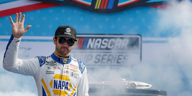 Chase Elliott, driver of the No. 9 NAPA Auto Parts Chevrolet, greets fans as he walks onstage during driver introductions ahead of the 65th Annual NASCAR Cup Series Daytona 500 at Daytona International Speedway on February 19, 2023, in Daytona Beach, Florida.