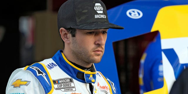 Chase Elliott watches as his crew works on his car during a practice for NASCAR's Daytona 500 Feb. 17, 2023, at Daytona International Speedway in Daytona Beach, Fla.