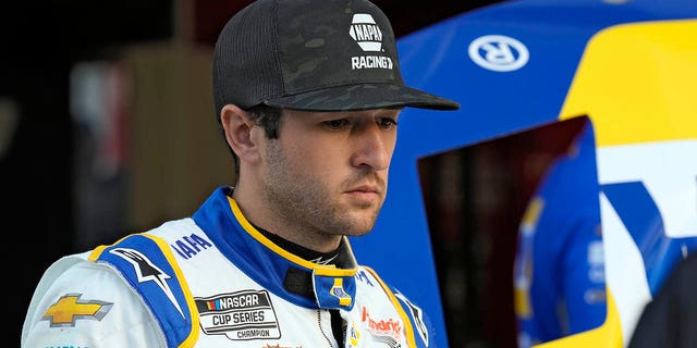 Chase Elliott watches as his team works on their car during practice for the NASCAR Daytona 500 on Friday, February 17, 2023, at Daytona International Speedway.