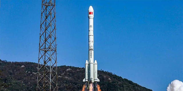 China is sending satellites into space which constitutes a change in security in space.  A rocket carrying a satellite launches into space in Sichuan Province, China.