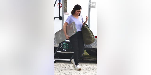 Christy Murdaugh is spotted exiting Liberty Auction in Pembroke, Ga., Wednesday, March 22, 2023. The wife of Randy Murdaugh collected some of her family's belongings from the upcoming auction before they could be sold.