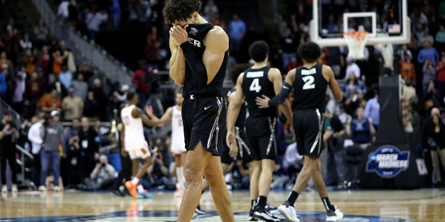 Colby Jones, #3 of the Xavier Musketeers, reacts to the scoreboard during the second half against the Texas Longhorns in the Sweet 16 round of the NCAA Men's Basketball Tournament at T-Mobile Center on March 24, 2023 in Kansas City, Missouri.