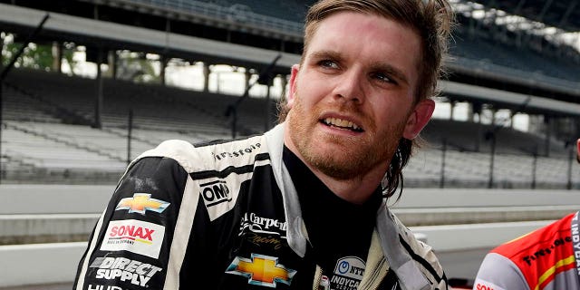 Conor Daly talks with his crew during practice for the Indianapolis 500 at Indianapolis Motor Speedway, May 19, 2021.